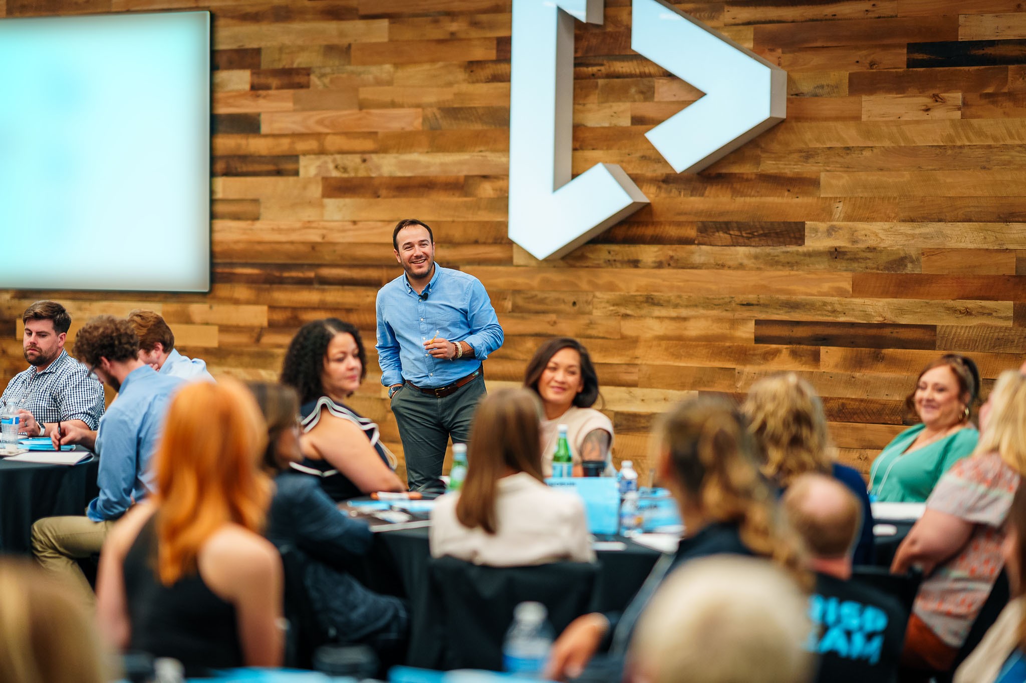 Chris Schembra speaking among the audience at Crisp