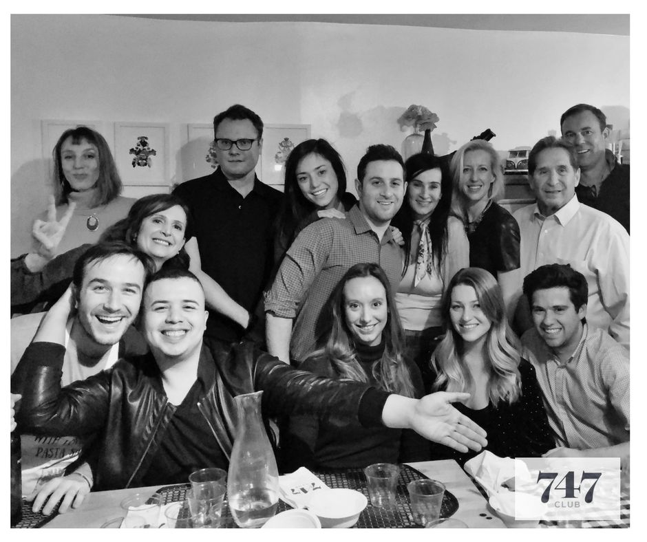 Guests gathered around a 7:47 dinner table