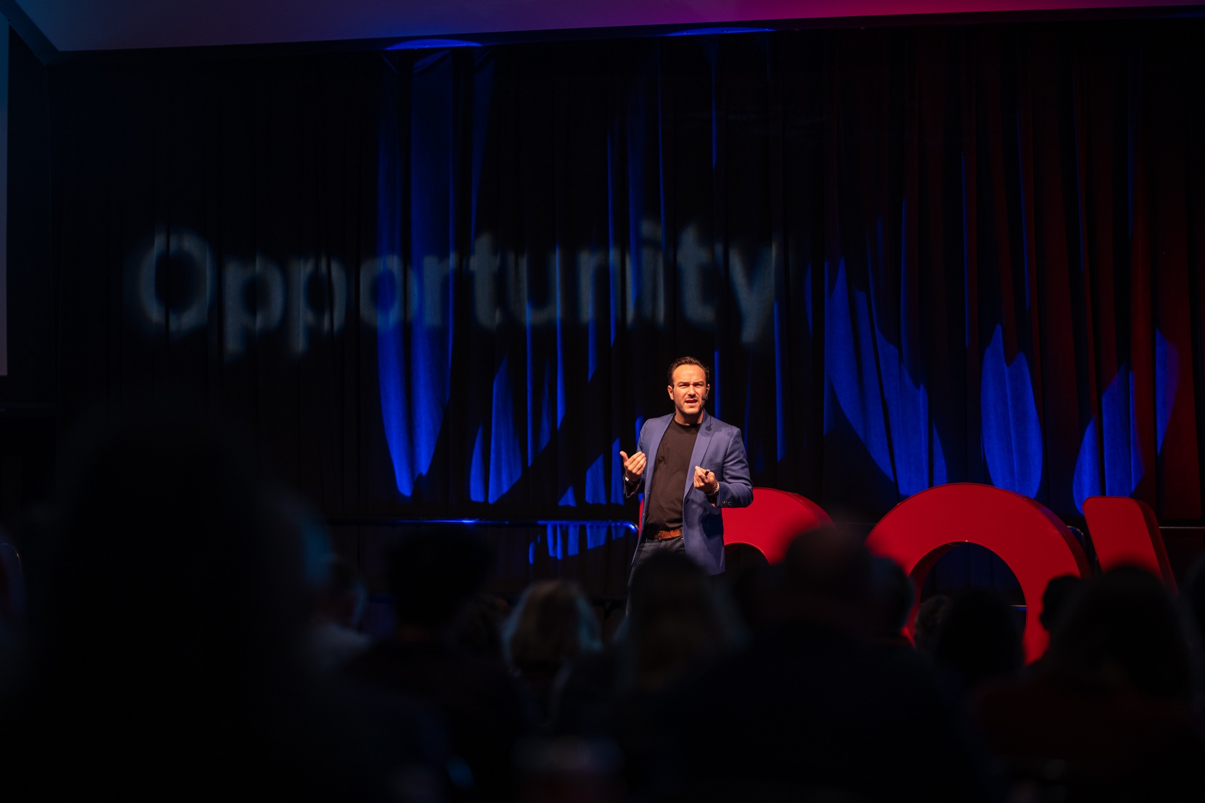 Chris Schembra delivering a keynote on stage at Alliance Summit