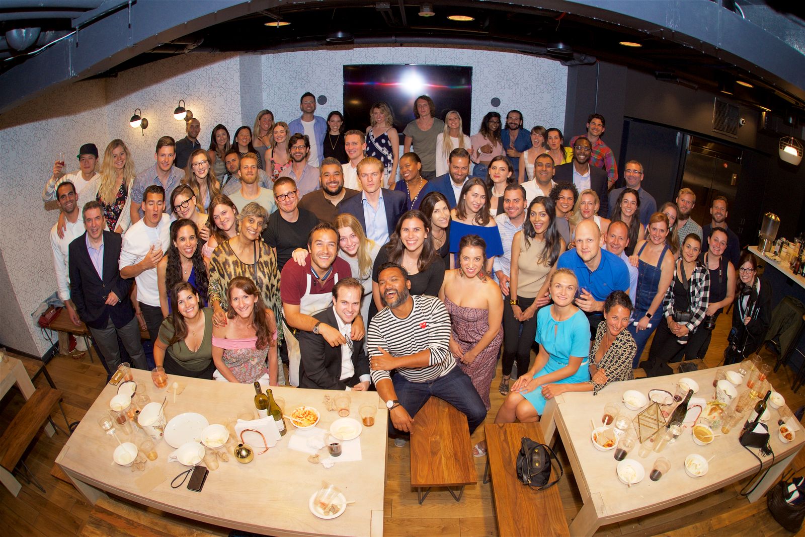 Guests gathered around a 7:47 dinner table