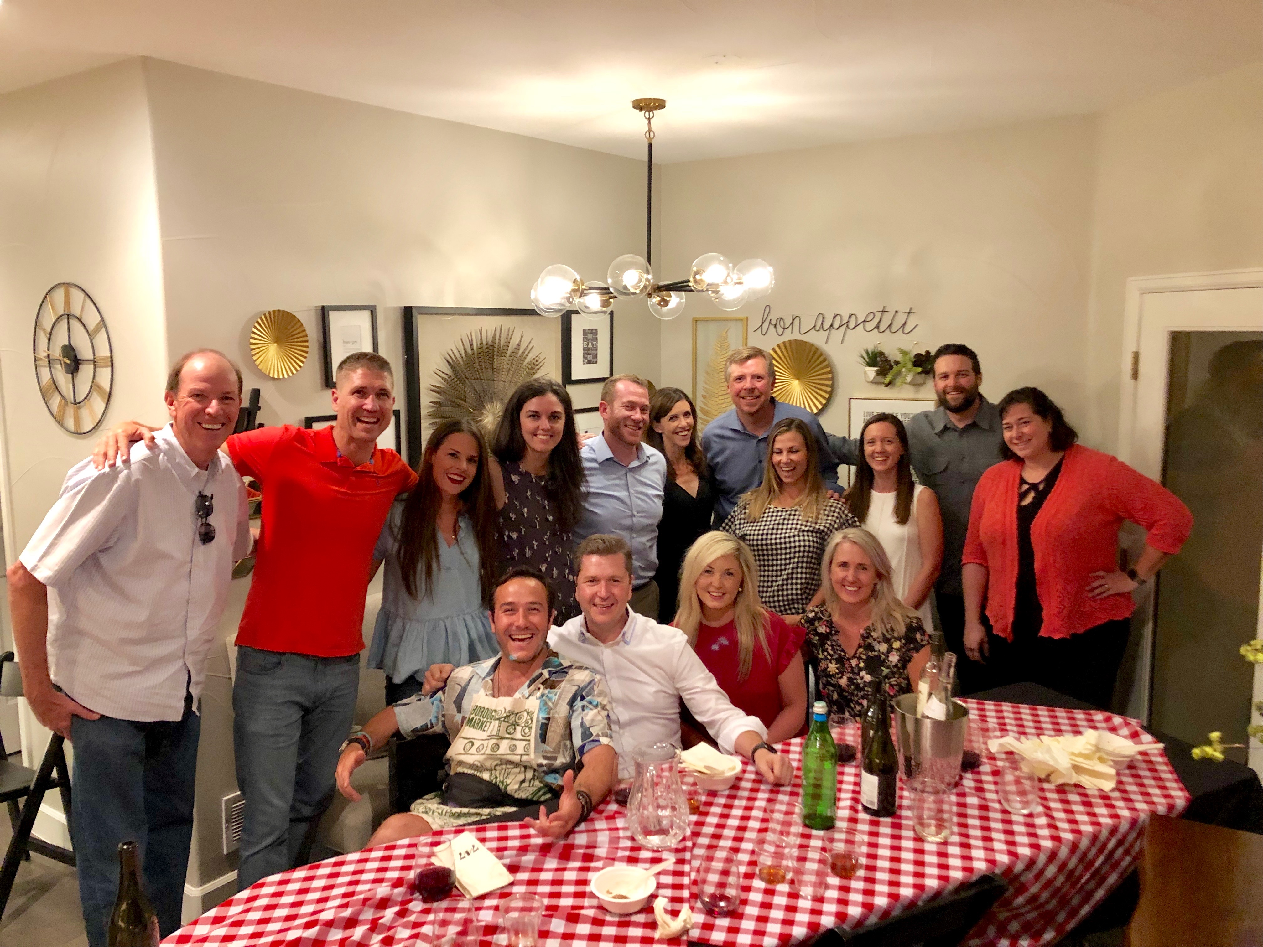 People gathered around a table at a 7:47 gratitude dinner